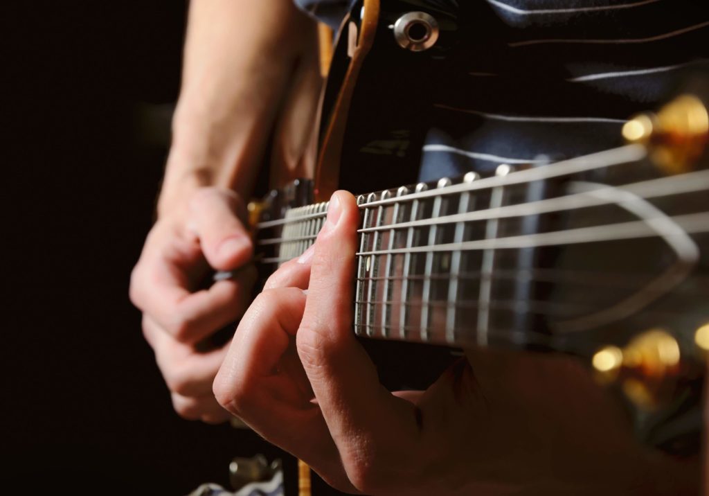 Picture of man playing electric guitar live music in Arlington TX